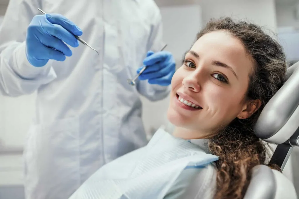 Woman smiling in dental chair during checkup at Beamsville Smiles Family Dentistry